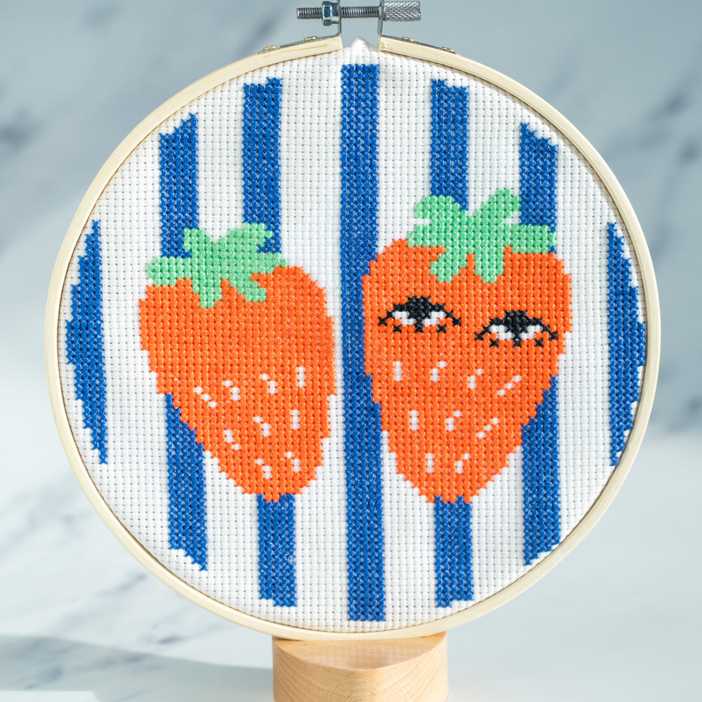 Strawberry cross stitch kit - completed on grey background