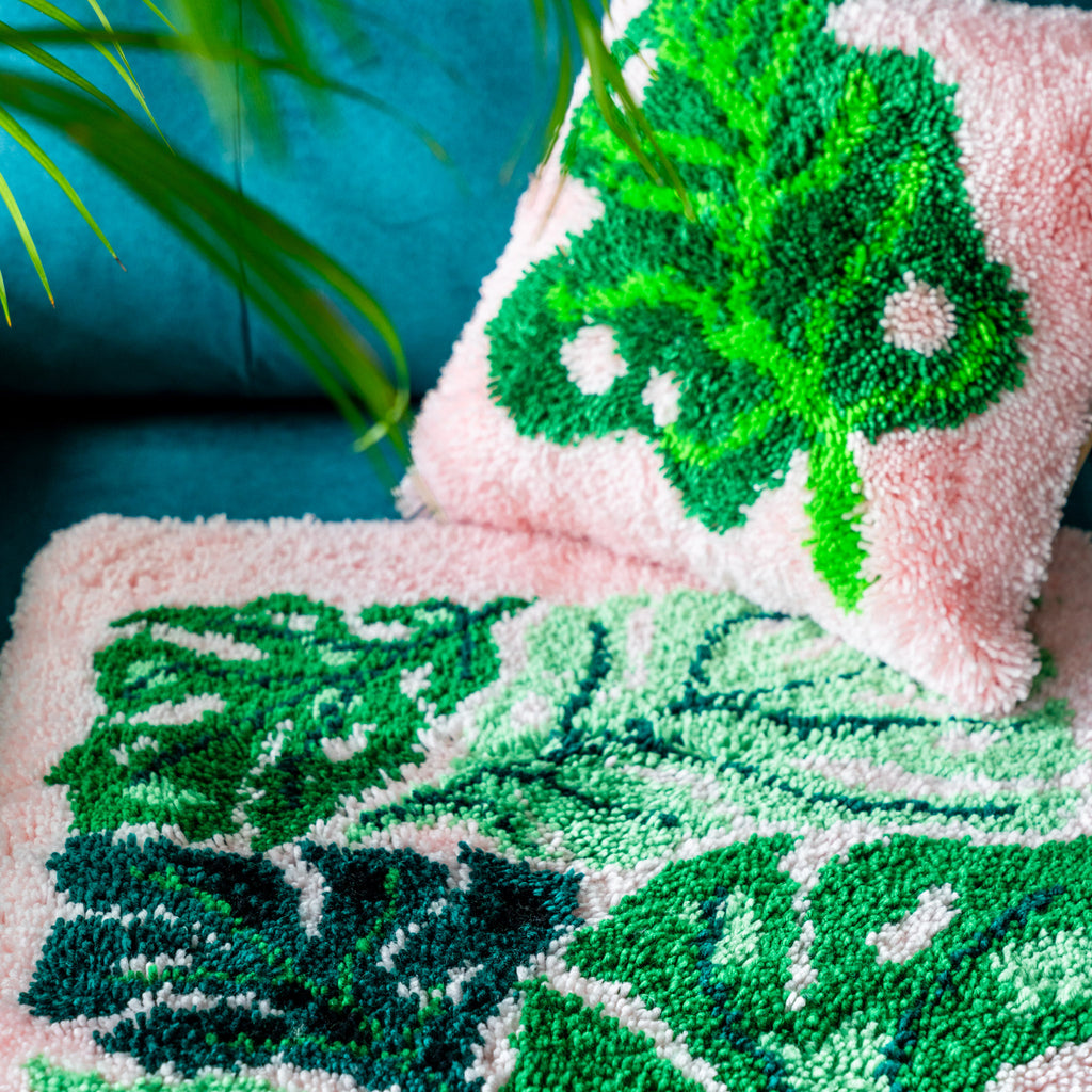 Lush and leafy cushion sitting on top of unbeleafable latch hooking kit