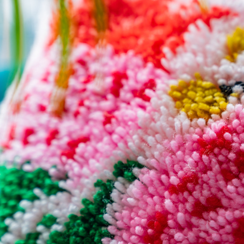 Close up of yarn detailing on floral rug hooking cushion kit 