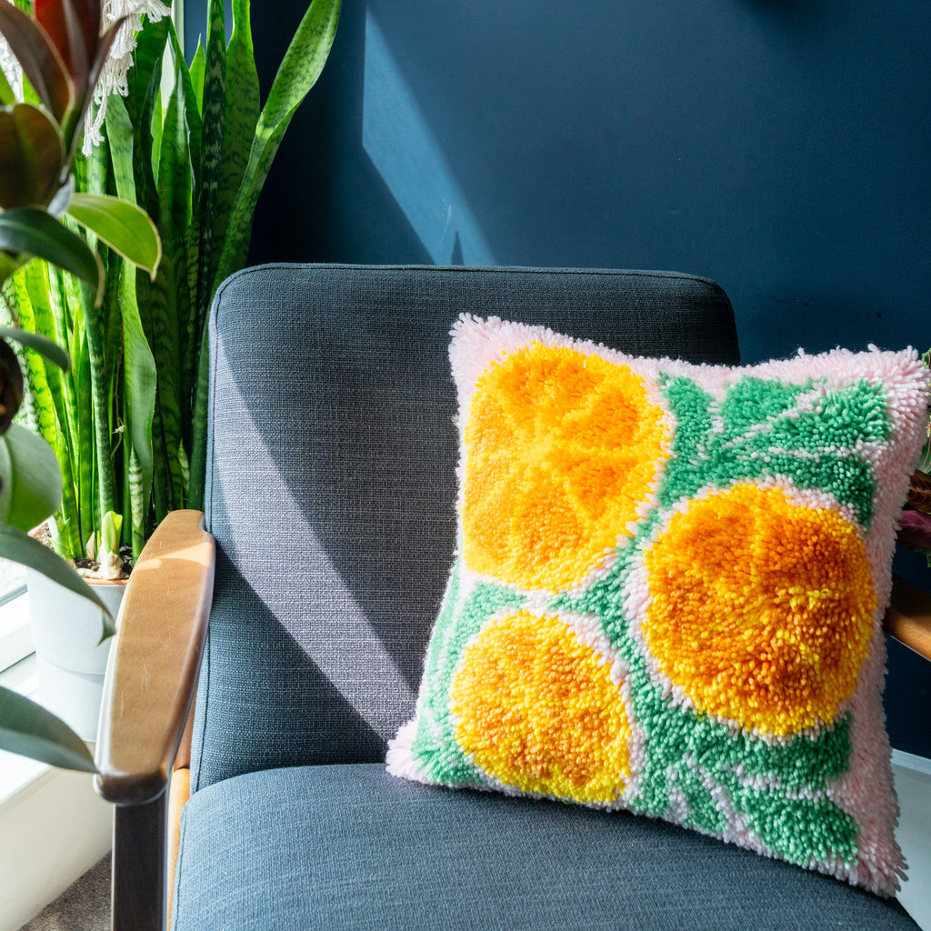 Oranges on pink background latch hook cushion 