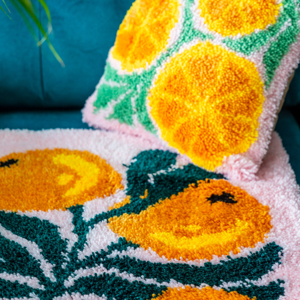 Set of latch hook rug and cushions with oranges 